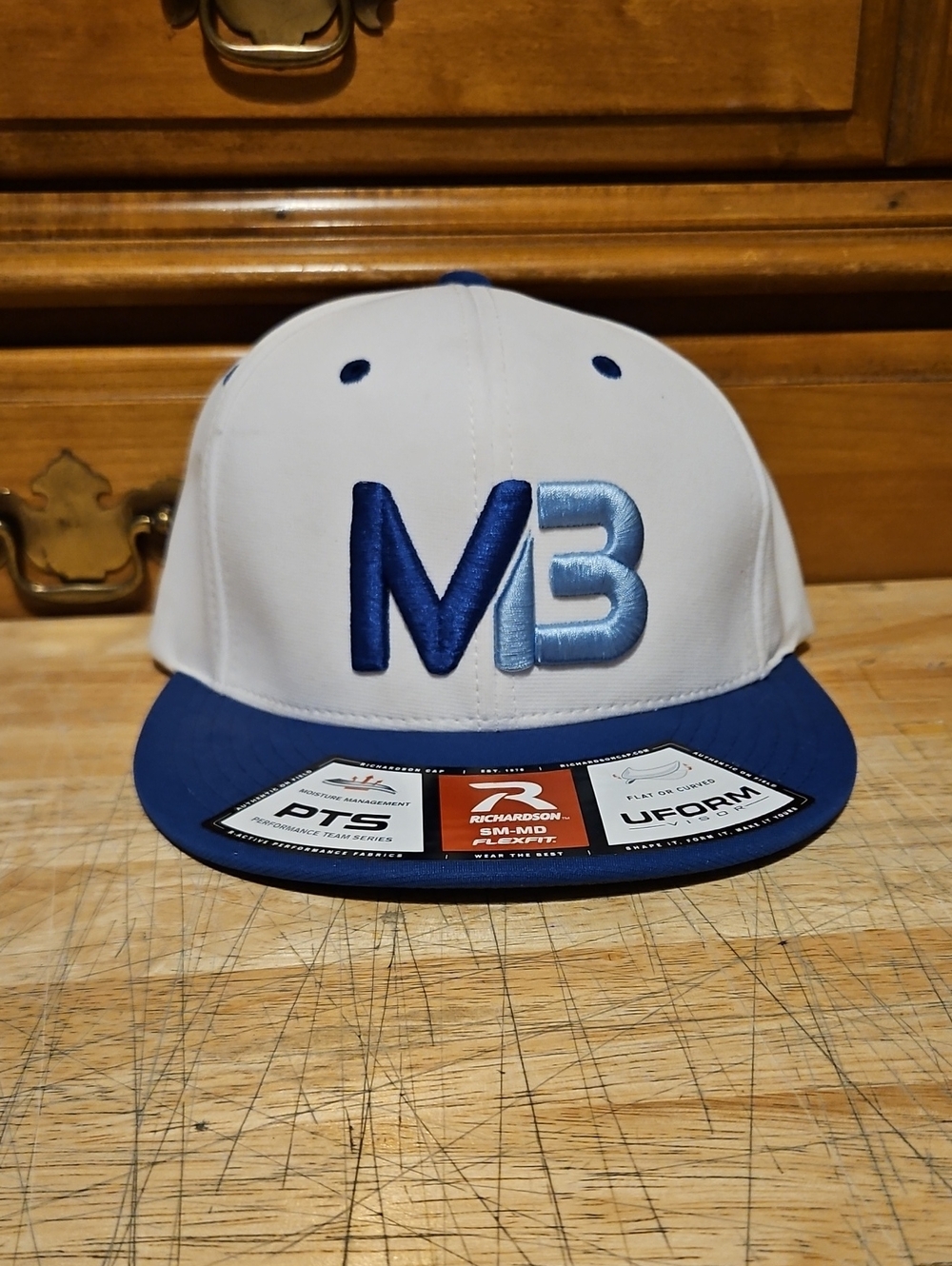 White and Blue MB Embroidered Snapback Hat